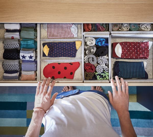 Organise your wardrobe using boxes for clothing