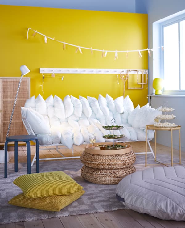 Our comfy sofa Loveseat from the IKEA PS 2017 collection has 36 pillows and comes in white or dark blue.