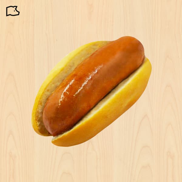 Overhead view of a glossy reddish-brown sausage in a golden hot dog bun on a light wood background, evoking a simple, appetizing meal.