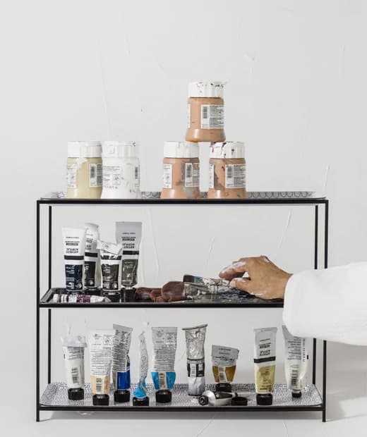 Paint tubes displayed on a black SAMMANHANG stand.