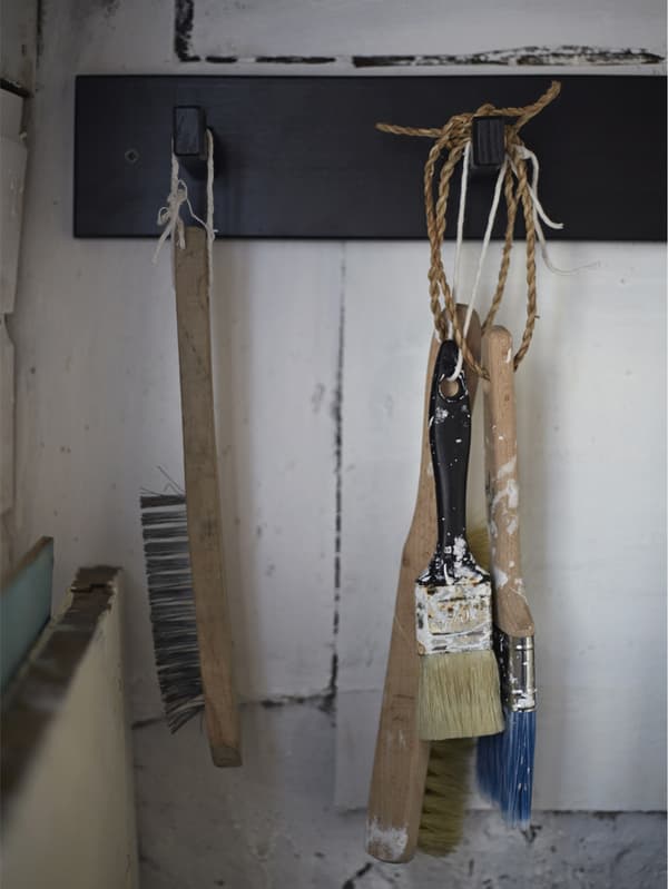 Paintbrushes hanging up to dry