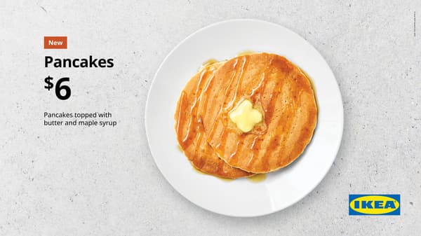 Pancakes. White plate on concrete background with 2 pancakes with melted butter over the top. For $6