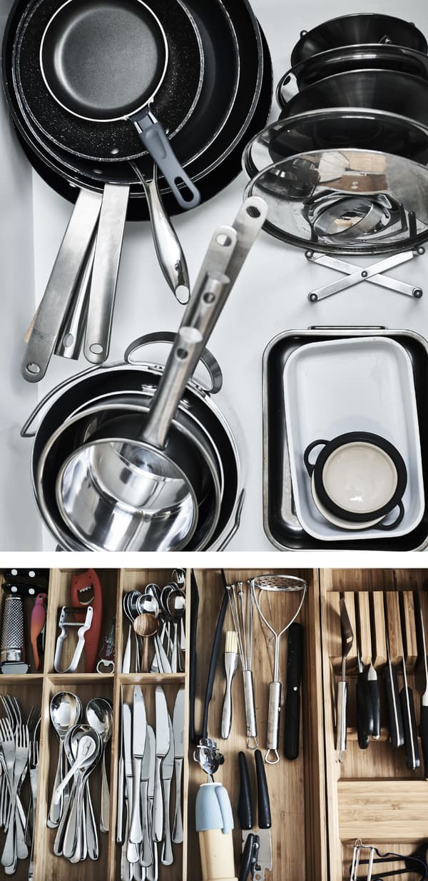 Pans and lids stacked in a drawer.