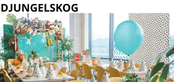 Party with jungle themed decorations, with various kinds of stuffed animal dolls.