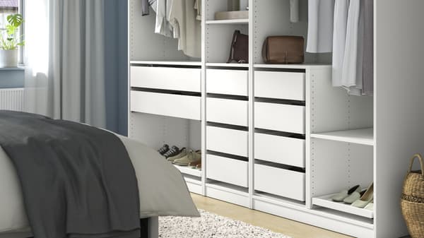 PAX storage solution(white) featured with clothes, shoes and other accessories arranged inside.