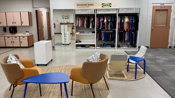 PAX units along wall with yellow chairs in front and blue tables, jute rugs on floor
