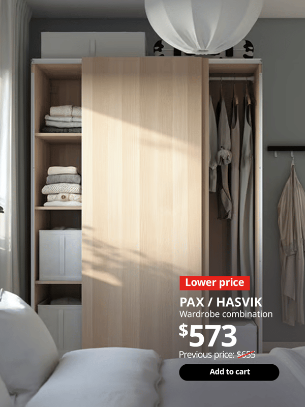 PAX wardrobe with HASVIK sliding doors in the bedroom, showing neatly organised clothes in stacks and hung up. 