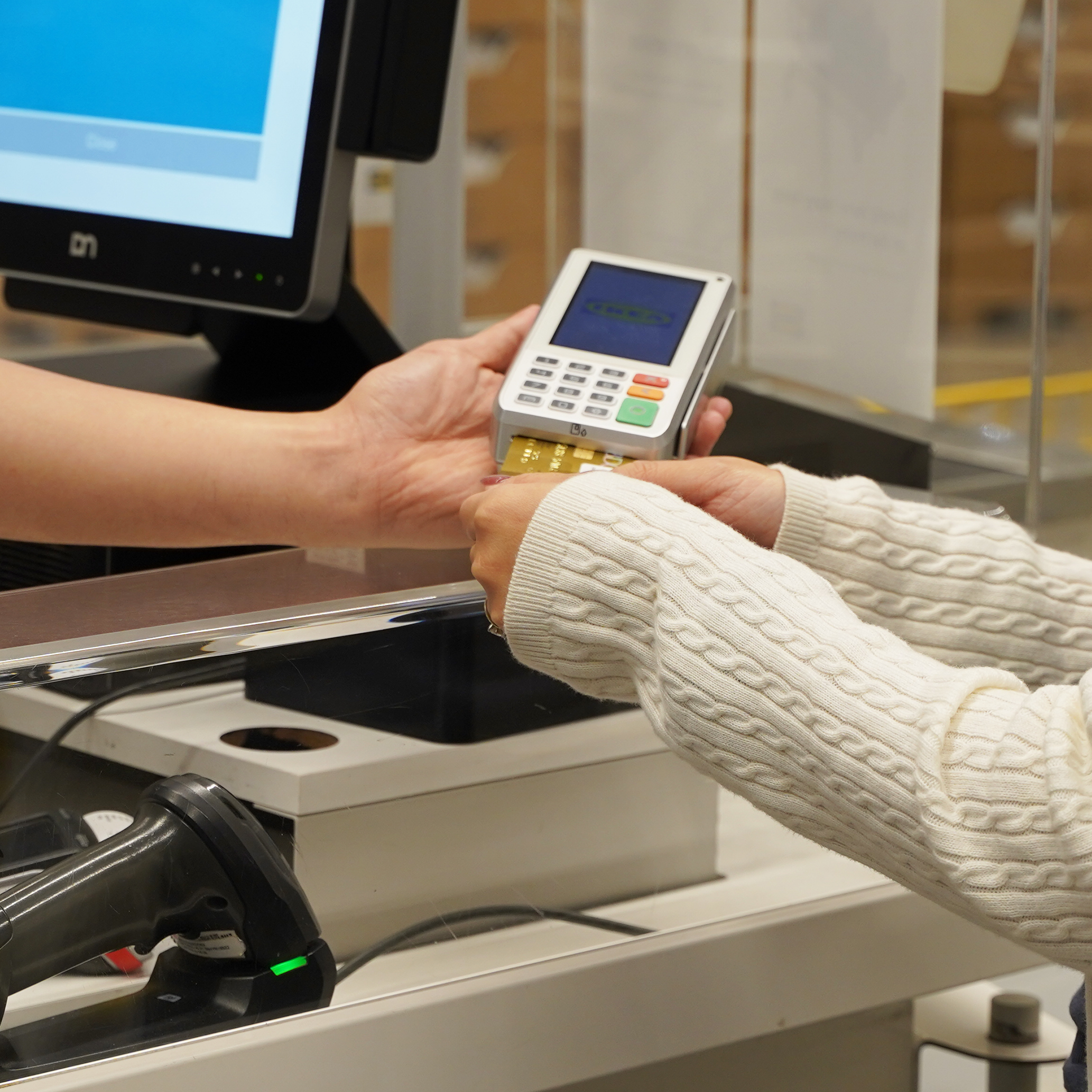 Payment options, a customer paying co-worker via card using card terminal