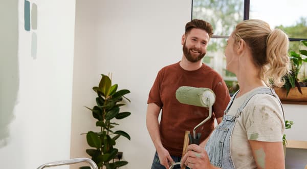 People painting a wall