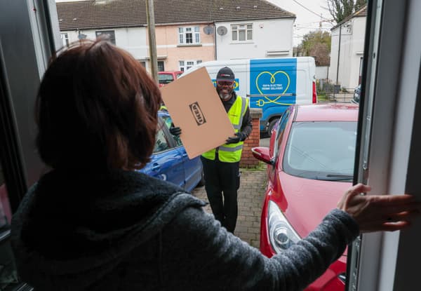 Person delivering an IKEA flat pack to a customer