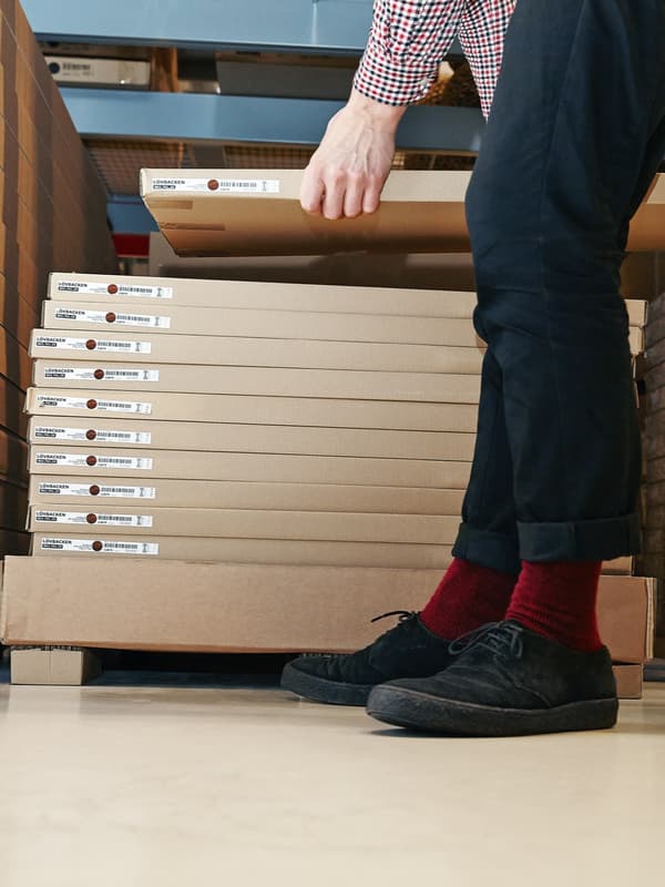 Person picking up an IKEA flatpack.