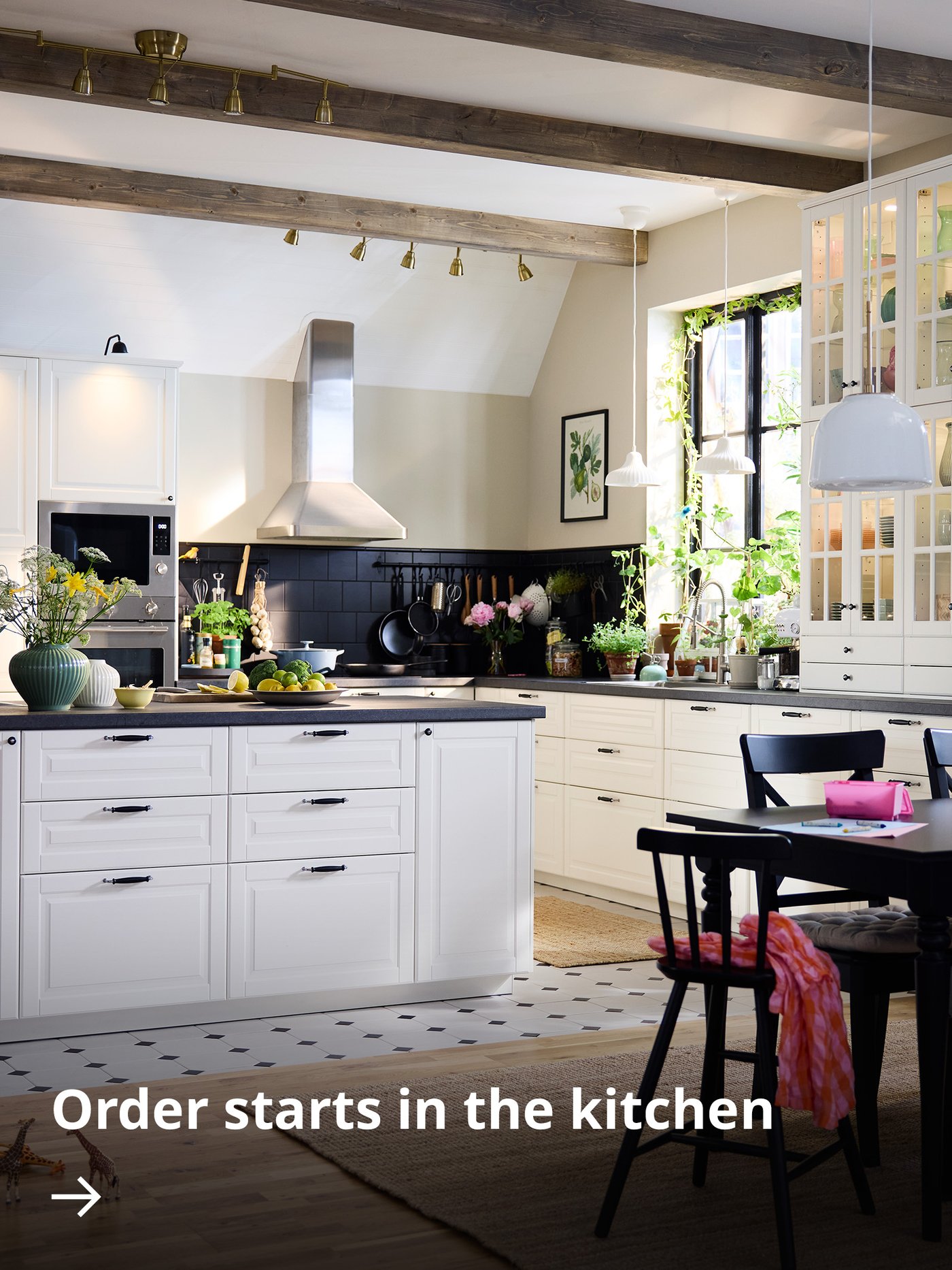 Person selecting spice jars from a wooden kitchen organizer on a countertop.