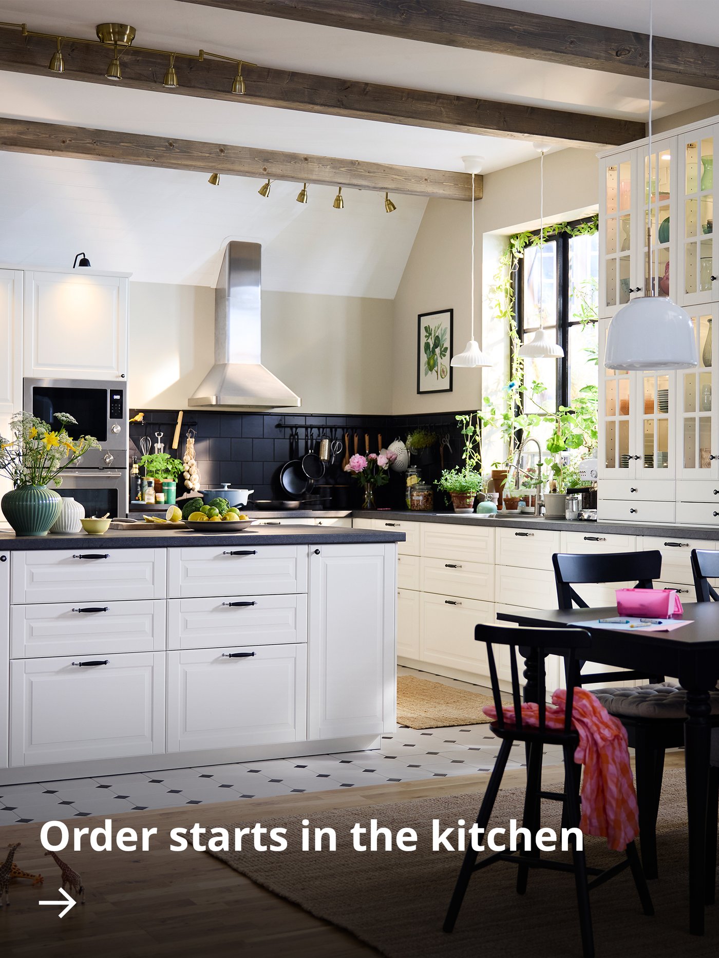 Person selecting spice jars from a wooden kitchen organizer on a countertop.