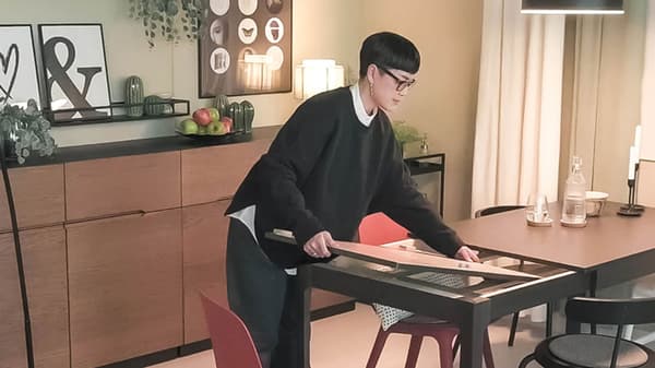 Person setting up table