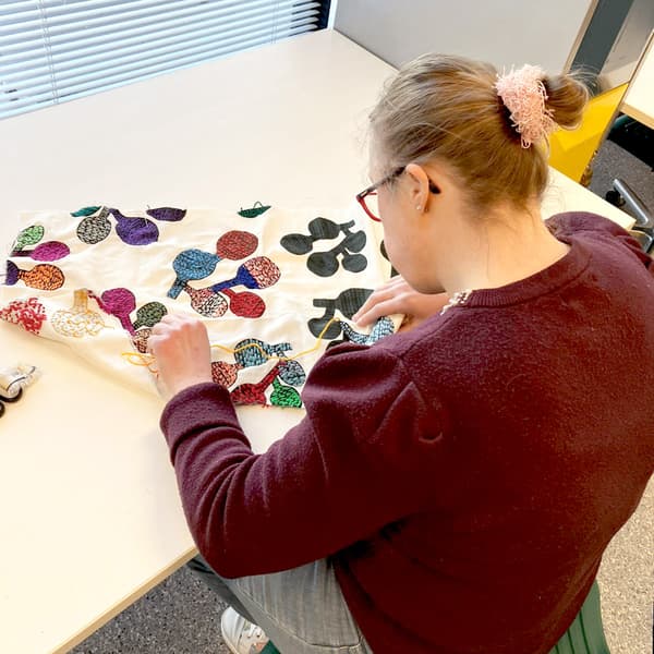Person working on textiles
