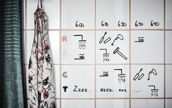 personalised schedule written on the bathroom tiles