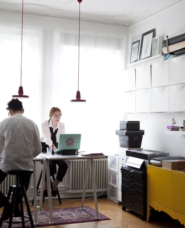 Peter and Elisabeth sitting at a desk.
