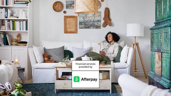 Photo of a woman laying on a couch 
