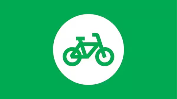 Pictograma arată o bicicletă verde într-un cerc alb pe un fundal verde.