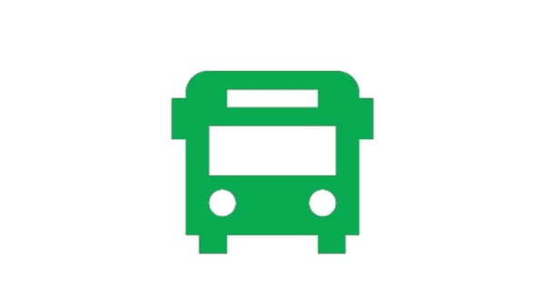 Pictogramă verde a unui autobuz, văzut din față, cu două faruri rotunde și un parbriz dreptunghiular.