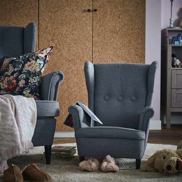 Picture of a wingback armchair and a child-size version alongside it.
