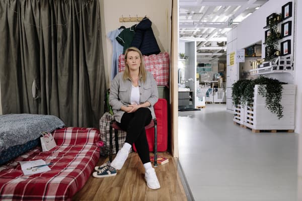 Picture of a woman, Sam, sitting on a chair in a real life roomset