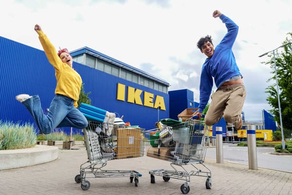 Picture of two shoppers jumping in the air