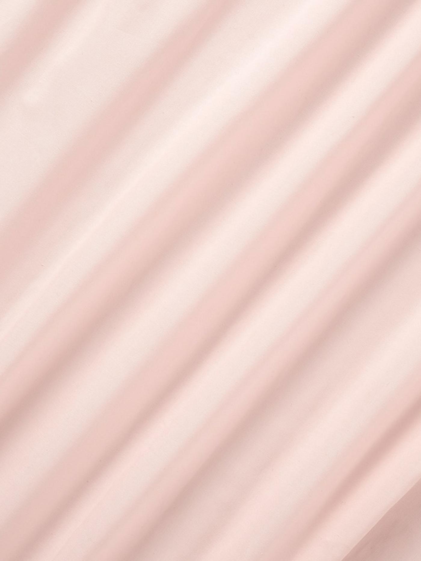 Pink curtain fabric close-up.
