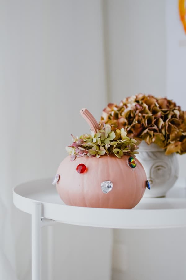 Pink pumpkin on a side table