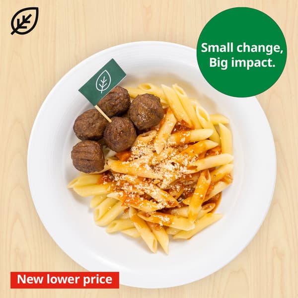 Plant balls with organic penne paste in tomato sauce with grated parmesan cheese. Plant food symbol at top left corner of thumbnail and sustainability message 