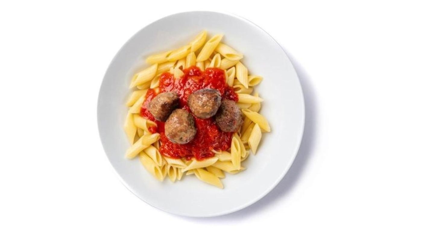 Plate of noodles with red sauce and meatballs