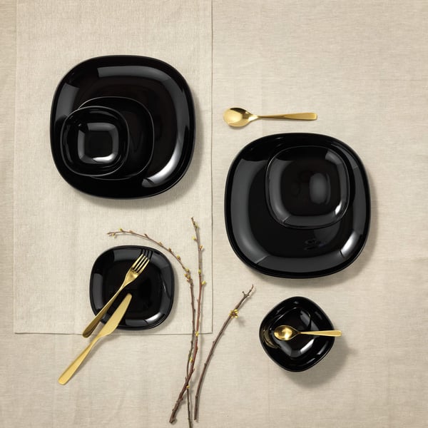 Plates and utensils on a table.