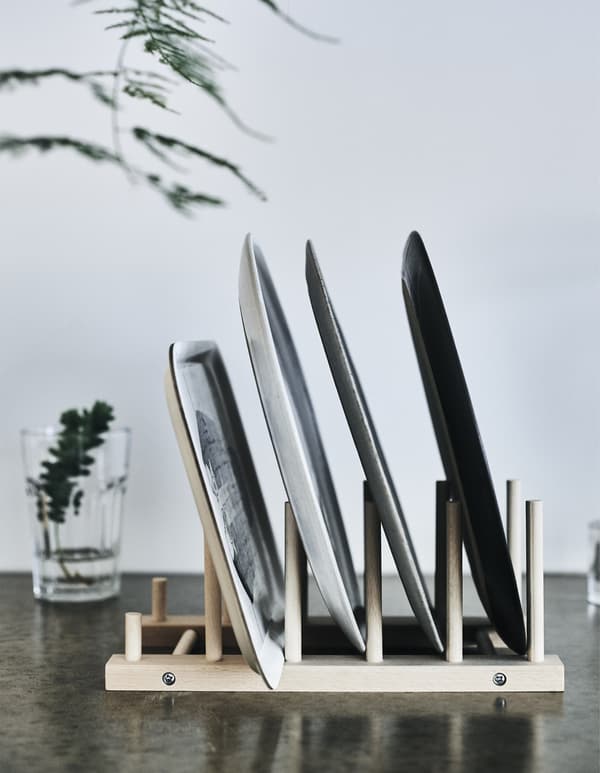 Plates stacked on a plate rack.