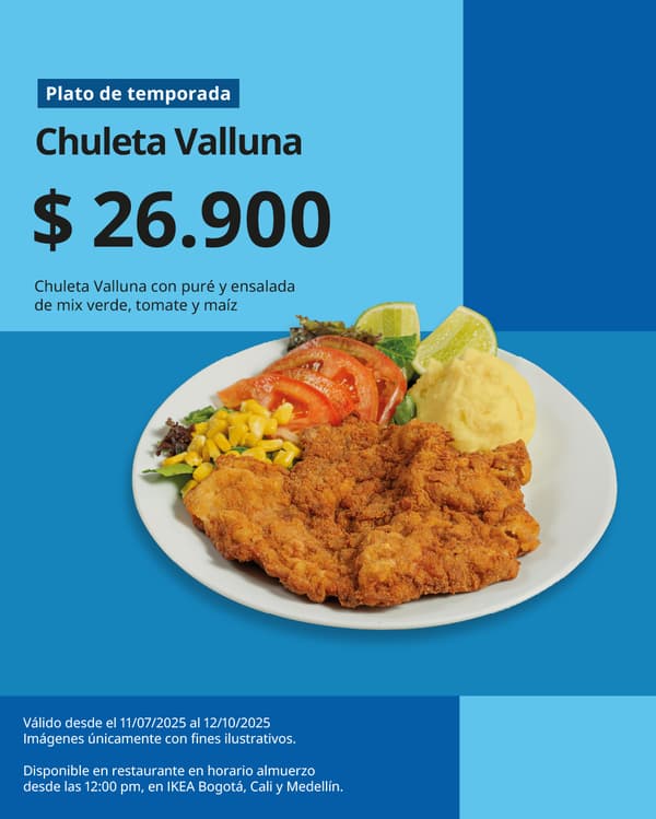 Plato de chuleta Valluna con verduras con fondo azul.