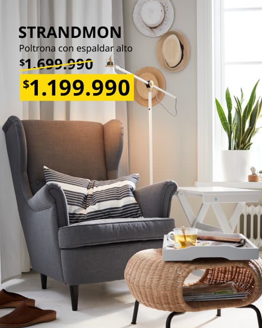 Poltrona gris STANDMOND en una sala