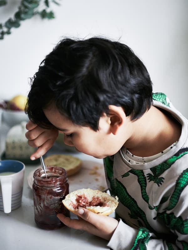 Portrait of Jules’s son Justus eating breakfast.