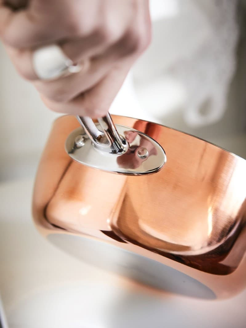 Pot and pan touching benchtop