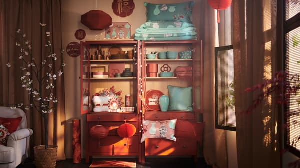 Products from the FÖSSTA collection tastefully arranged on shelving in a room with sun streaming through the shutters.