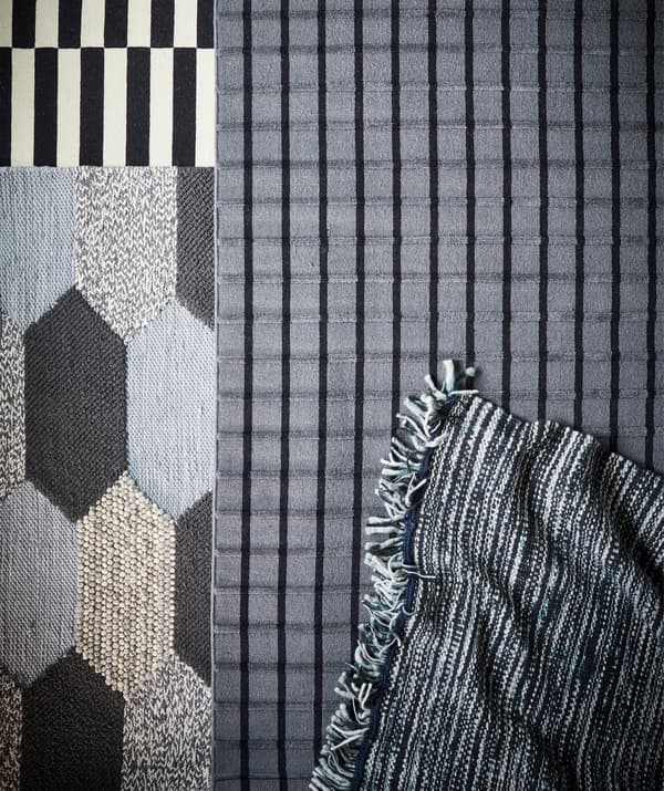 Quatre tapis différents avec des motifs monochrome et des lignes.