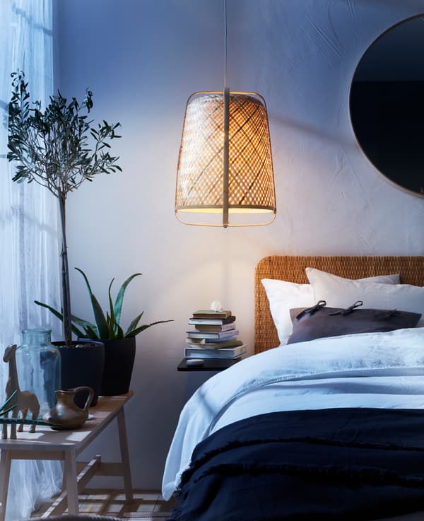 Rattan headboard in a bedroom with natural materials