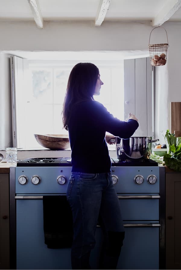 Rebecca stirs the compote.