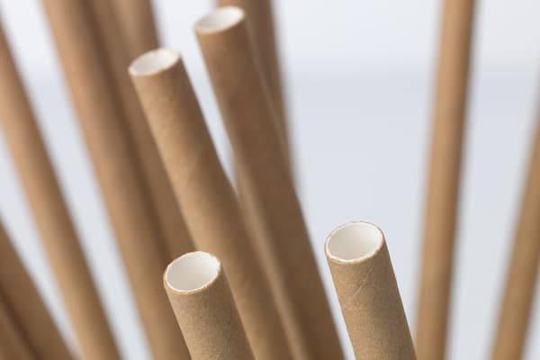 Recycled paper straws in brown and white