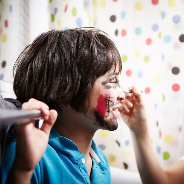 Red & white face painting for national day at National Day Singapore
