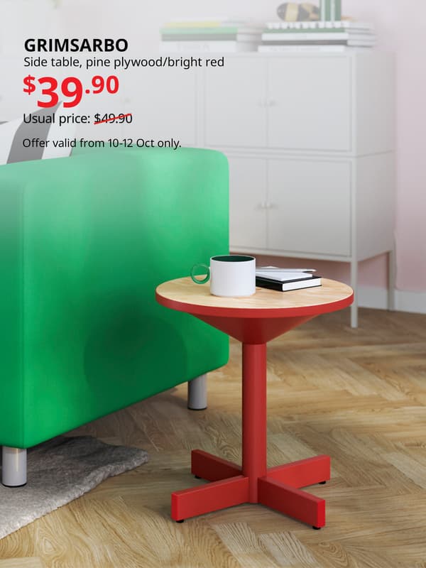 Red GRIMSARBO side table in living room beside a bright green KLIPPAN sofa. Usual price with slash: $49.90. 10.10 price: $39.90. IKEA Alexandra birthday sale, 10.10 sale