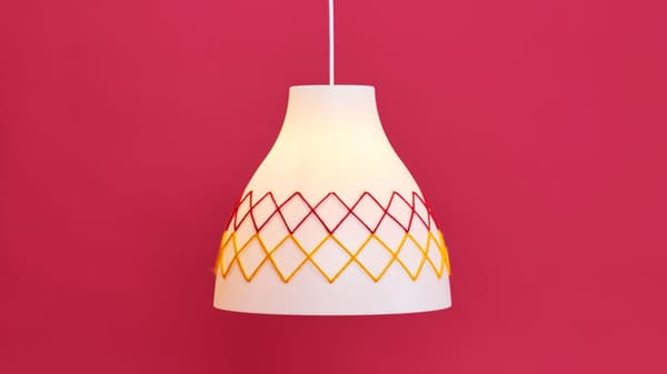 Redesigned melody lamp on a pink background.