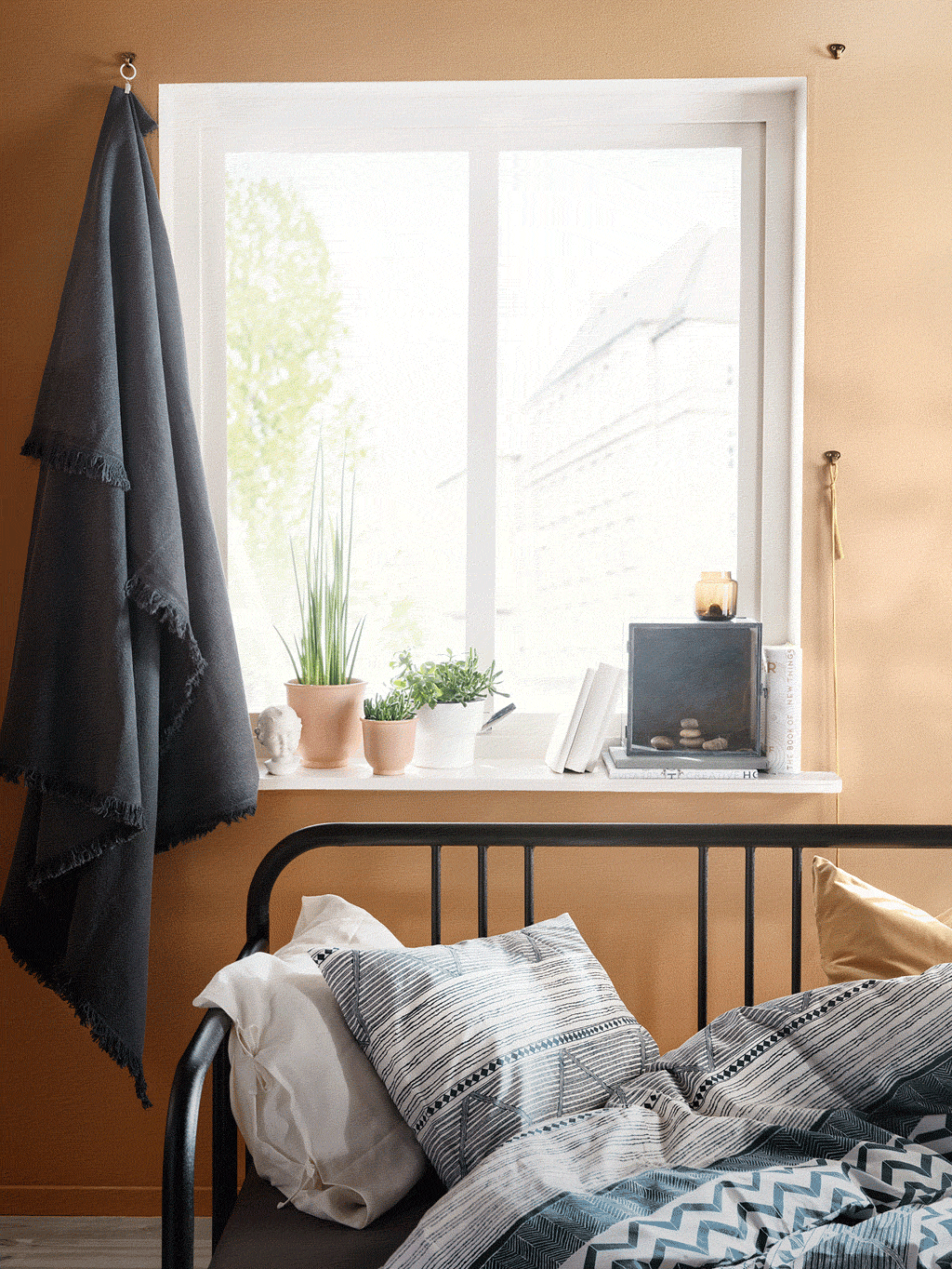 Reduce noise in your bedroom! Use your favourite throw that you hang from hooks using two curtain rings with clips. IKEA offers a wide selection of comfy throws such as JOFRID throw in dark blue-grey!