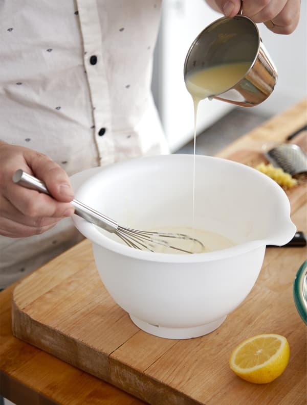 Rober whisking up the ingredients for a lemon mousse.