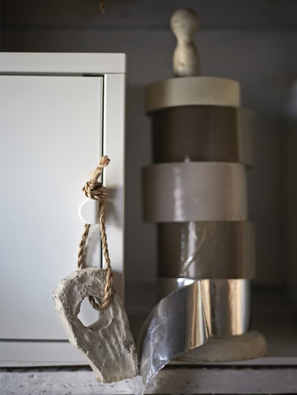 Rolls of tape stored on a kitchen towel holder