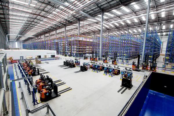 Rows of forklift trucks parked inside IKEA's new customer distribution centre in Dartford, Kent