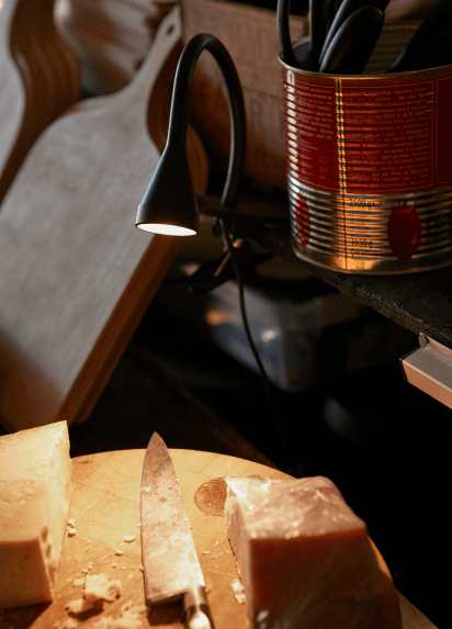 Rustic interior of restaurant with waitress carrying a tray out of focus